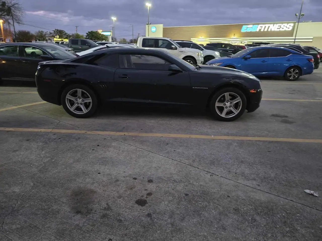 Black Chevrolet Camaro sold for cash in a Dallas parking lot
